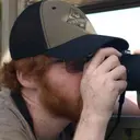 Picture of me holding a camera with the viewfinder to my eye